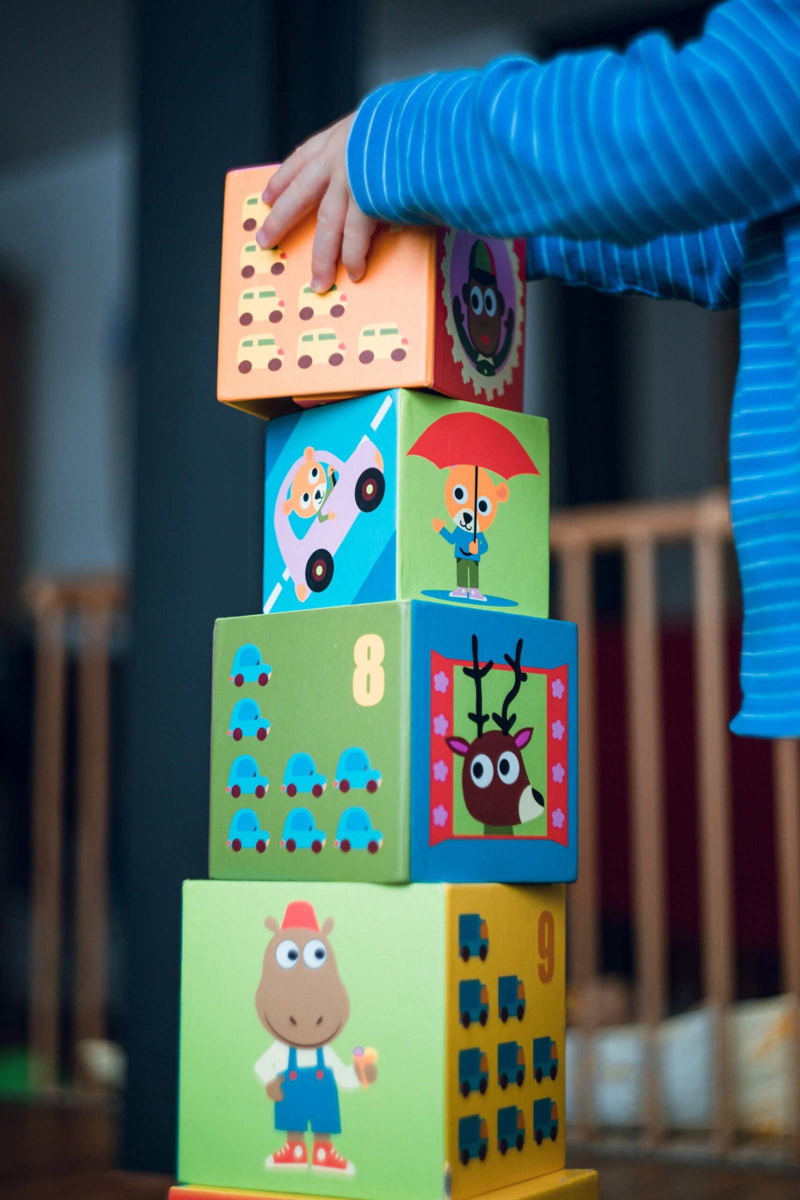 child building an four boxes